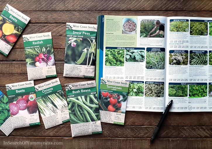 Seed packets of vegetables that are easy to grow on a table | InSearchOfYummyness